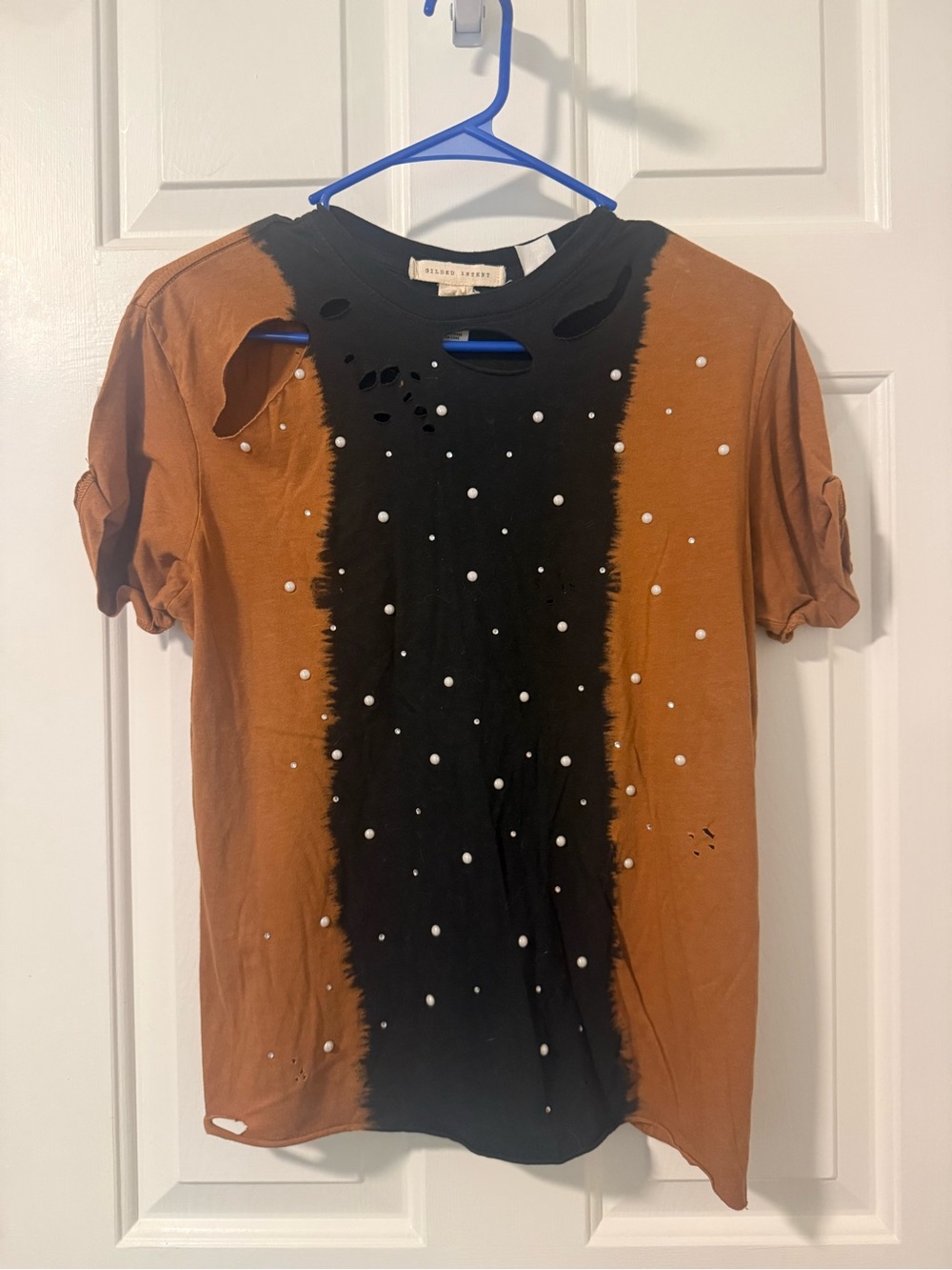 Gilded Intent Black Tee with Cream Label & Blue Hanger Accent